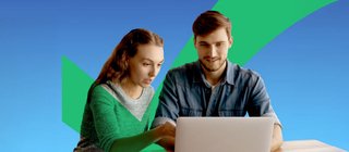 Couple looking at healthcare bill on computer