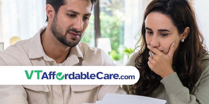 Man and woman looking at a bill
